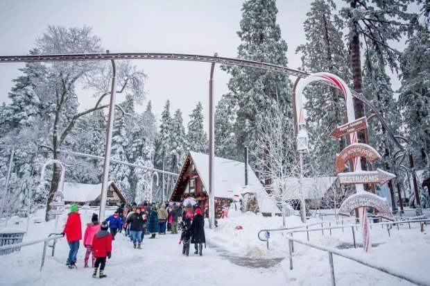 Visitors take in the sights as a winter storm hits the San Bernardino National Forest at Sky Park at Santa's Village in Sky Forest, Saturday, Dec. 24, 2016. (Eric Reed/For The Sun/SCNG)