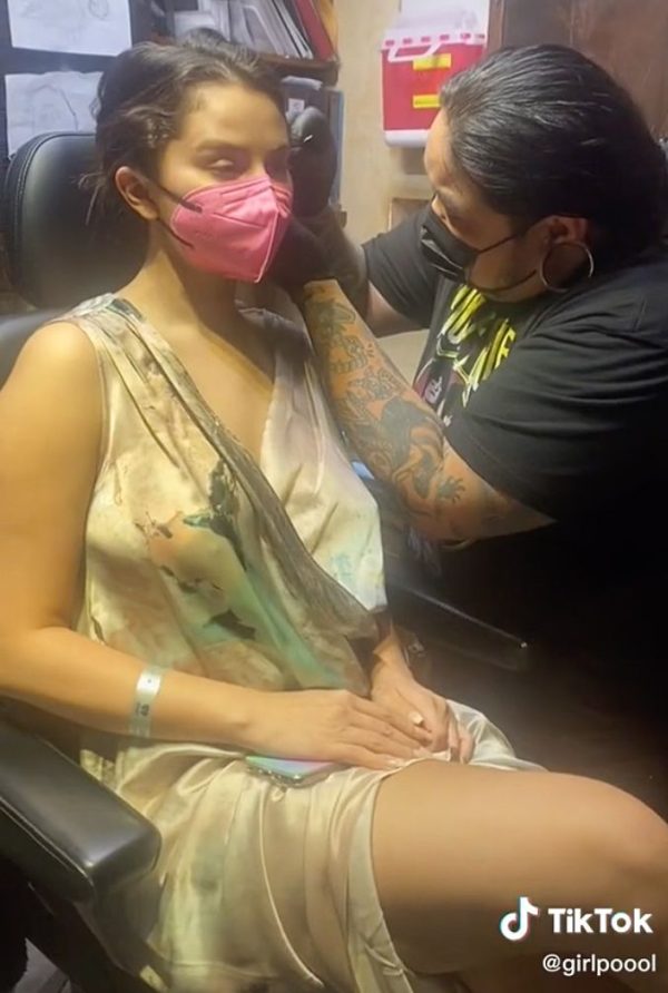 selena gomez getting pierce at studio city tattoo